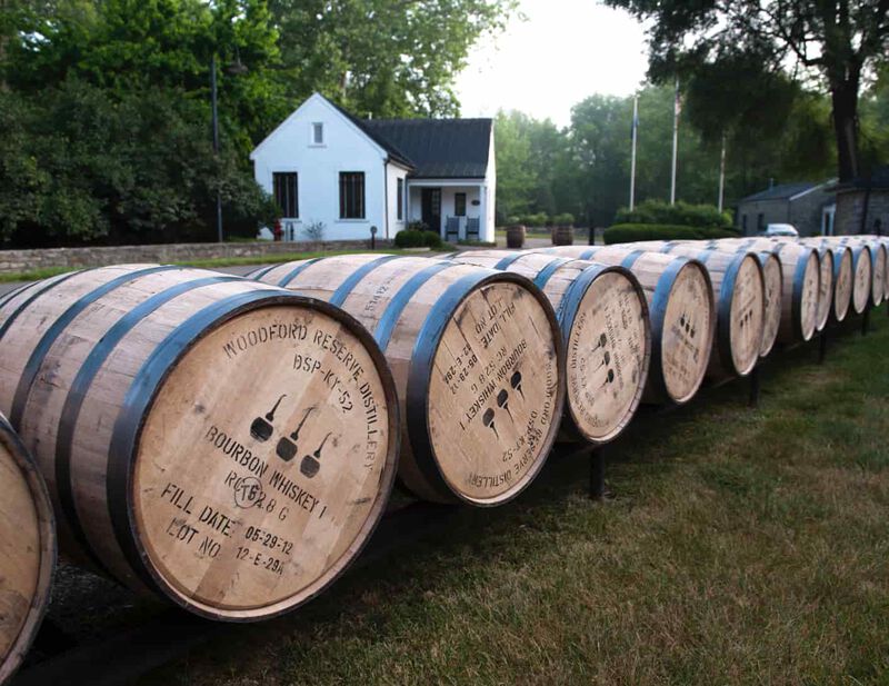 Barrels are laid out in a row on the grounds of Woodford Reserve